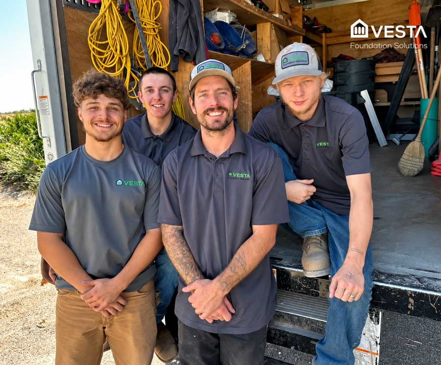 Vesta Foundation Solutions install crew standing at their work truck